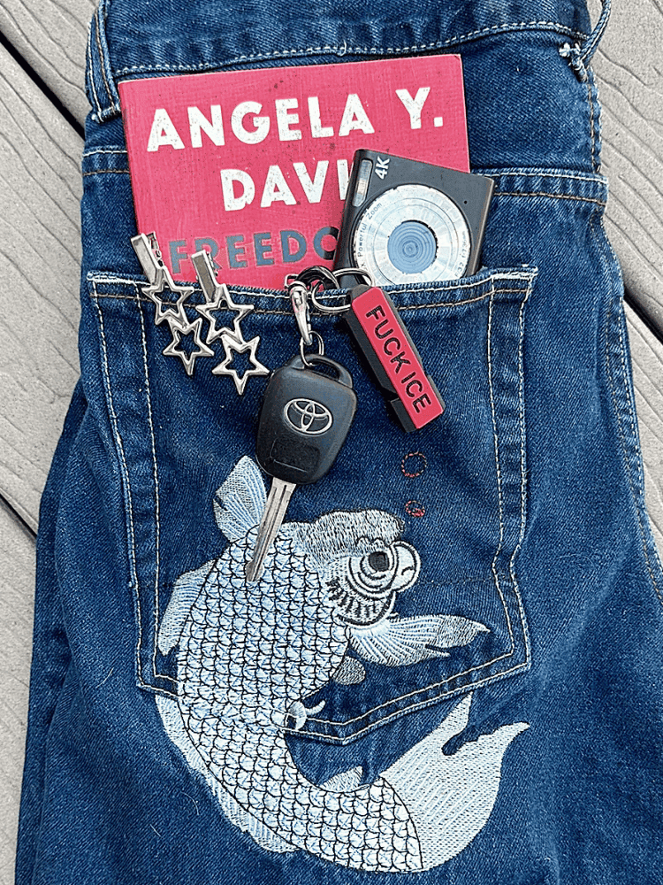 jean shorts with koi fish embroidery